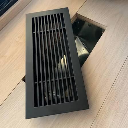 Floor-mounted return air grille in commercial space